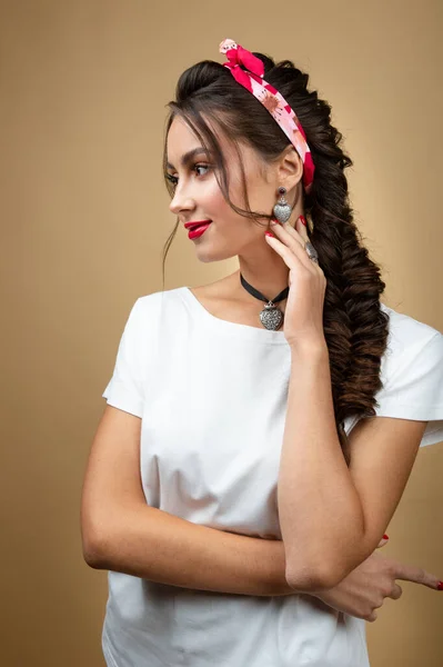 young woman in luxury silver jewelry posing