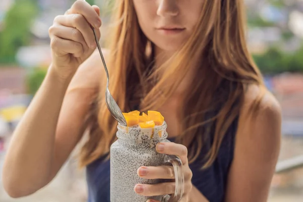Young Woman Eating Chia Pudding Her Balcony Overlooking Big City — Stock Photo, Image