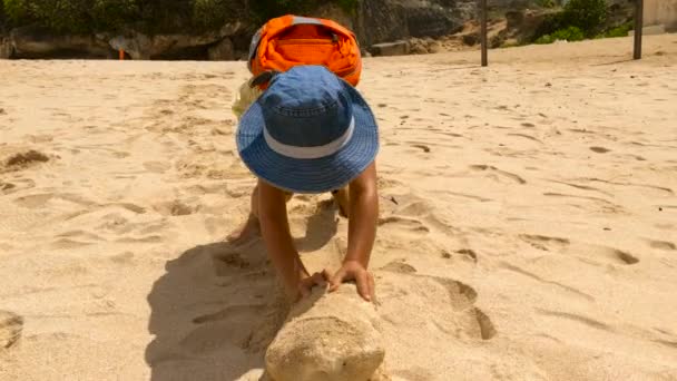 Boy Pushing Heavy Stone Beach Shore Bali Island — Stock Video