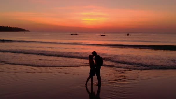 Slowmotion Aerial Shot Young Couple Kissing Sunset Son Running Nearby — Stock Video