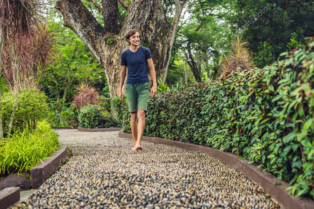 Man Walking On A Textured Cobble Pavement, Reflexology (en inglés