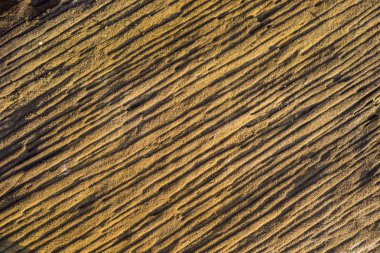 Ana kaya, Bali, Endonezya adanın kıyısında katmanlı kaya.