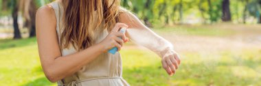 Woman spraying insect repellent on skin outdoor. BANNER, long format clipart
