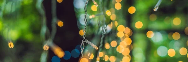 LED lights garland, colorful light bulbs on a bokeh background BANNER, long format — Stock Photo, Image