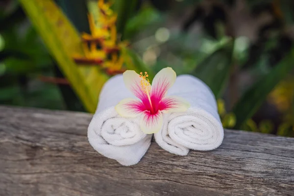 Two White Rolled Towels Flower Wooden Surface — Stock Photo, Image