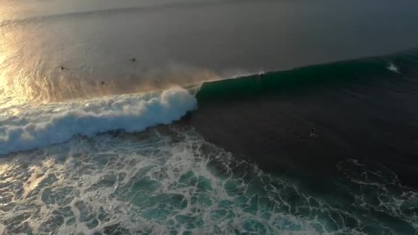 Aerial shot of a surfing spot on a tropical island at sunset — Stock Video