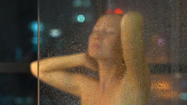 Young Woman Taking Shower Bathroom Window Silhouettes Illuminated Cityscape Night — Stock Video