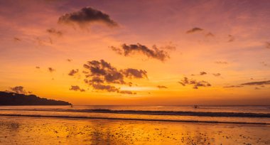 Scenery of tropical Jimbaran beach on Bali at sunset. clipart