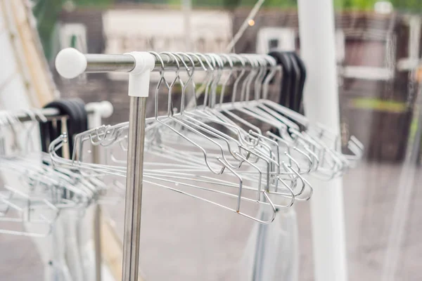 Iron empty clothes hangers. dry cleaning concept — Stock Photo, Image