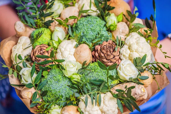 Bouquet of vegetables and fruits, useful gift for a healthy lifestyle, a detox diet. broccoli, cauliflower, ginger, cedar cone.
