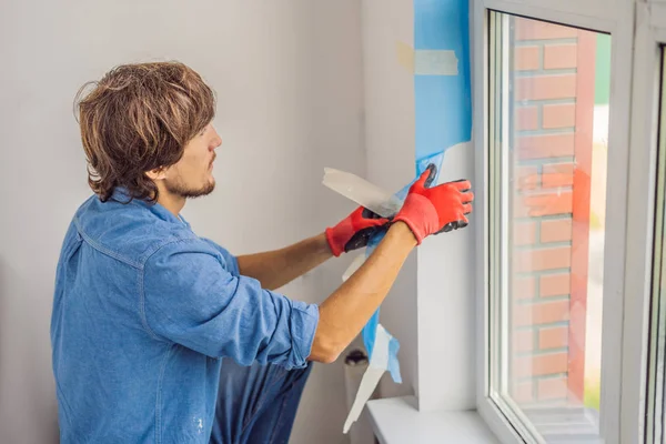 Young Professional Working Adhesive Tape While Window Installation — Stock Photo, Image
