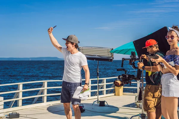 Director on a musical clip production set working with a mood of the group — Stock Photo, Image