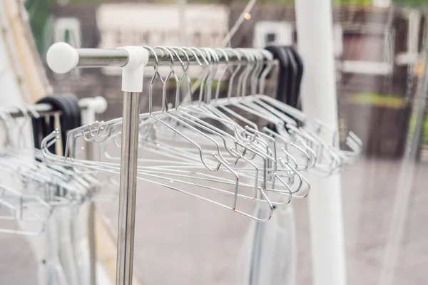 Iron empty clothes hangers. dry cleaning concept — Stock Photo, Image