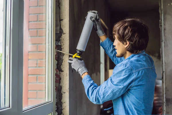 Young Handyman Blue Shirt Using Foam Power Tool While Window — Stock Photo, Image