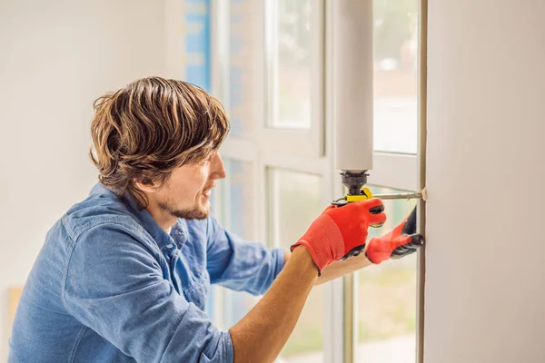 Young Handyman Blue Shirt Using Foam Power Tool While Window — Stock Photo, Image