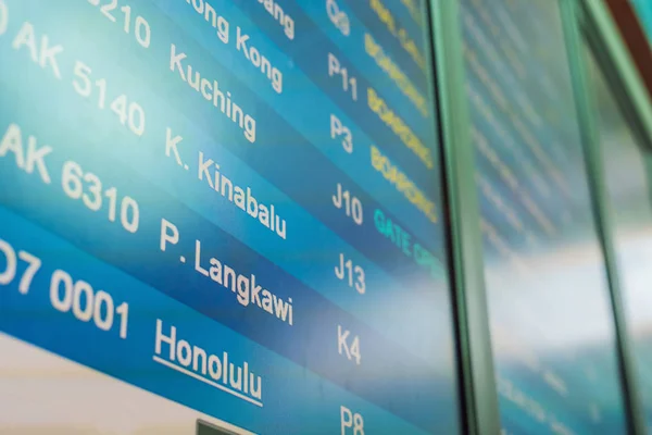 info of flight on billboard in airport