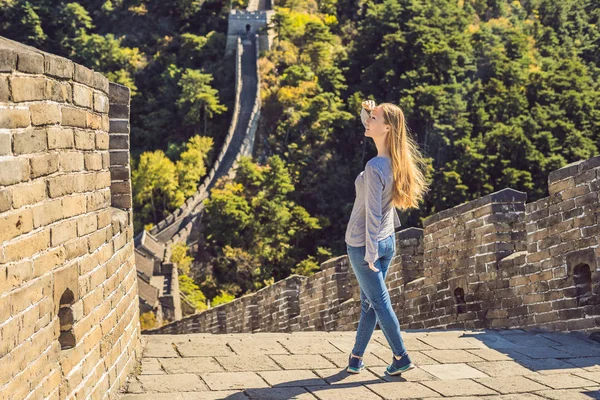 Happy cheerful joyful tourist woman at Great Wall of China having fun on travel smiling laughing and dancing during vacation trip in Asia. Girl visiting and sightseeing Chinese destination — Stock Photo, Image