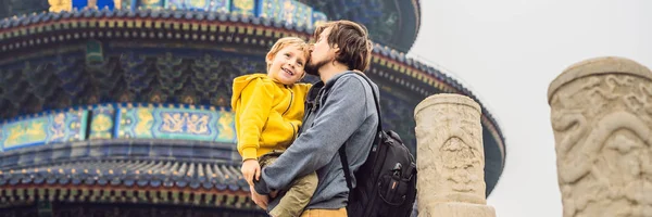 Dad and son travelers in the Temple of Heaven in Beijing. One of the main attractions of Beijing. Traveling with family and kids in China concept BANNER, LONG FORMAT