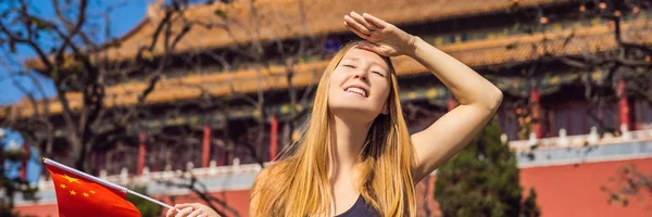 Enjoying vacation in China. Young woman with national chinese flag in Forbidden City. Travel to China concept. Visa free transit 72 hours, 144 hours in China BANNER, LONG FORMAT