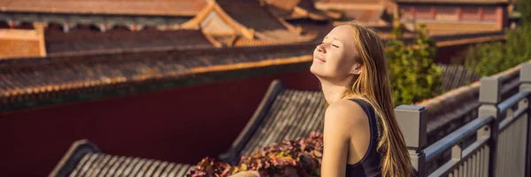 Enjoying vacation in China. Young woman in Forbidden City. Travel to China concept. Visa free transit 72 hours, 144 hours in China BANNER, LONG FORMAT