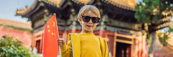 Enjoying vacation in China. Young boy with national chinese flag in Forbidden City. Travel to China with kids concept. Visa free transit 72 hours, 144 hours in China BANNER, LONG FORMAT — Stock Photo, Image