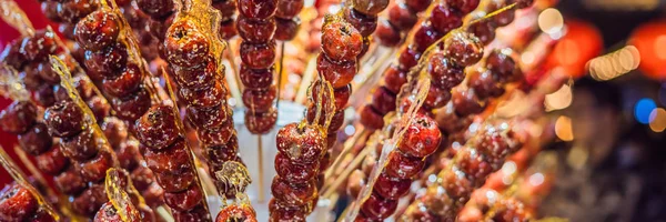 Traditional Chinese Dessert - Candied Fruit on a Wooden Stick BANNER, LONG FORMAT — Stock Photo, Image