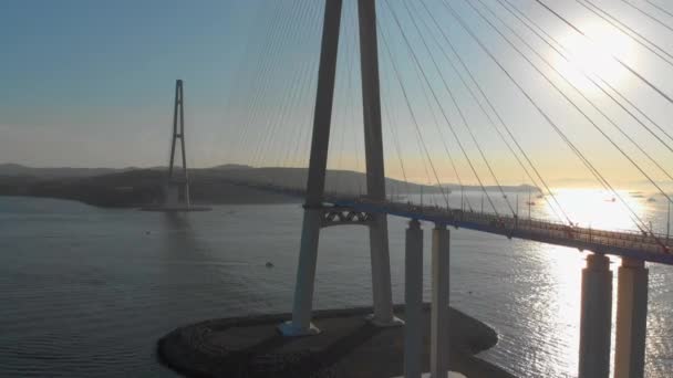 Aerial shot of the Russkiy cable bridge during sunset in a city of Vladivostok, Russia — Stock Video