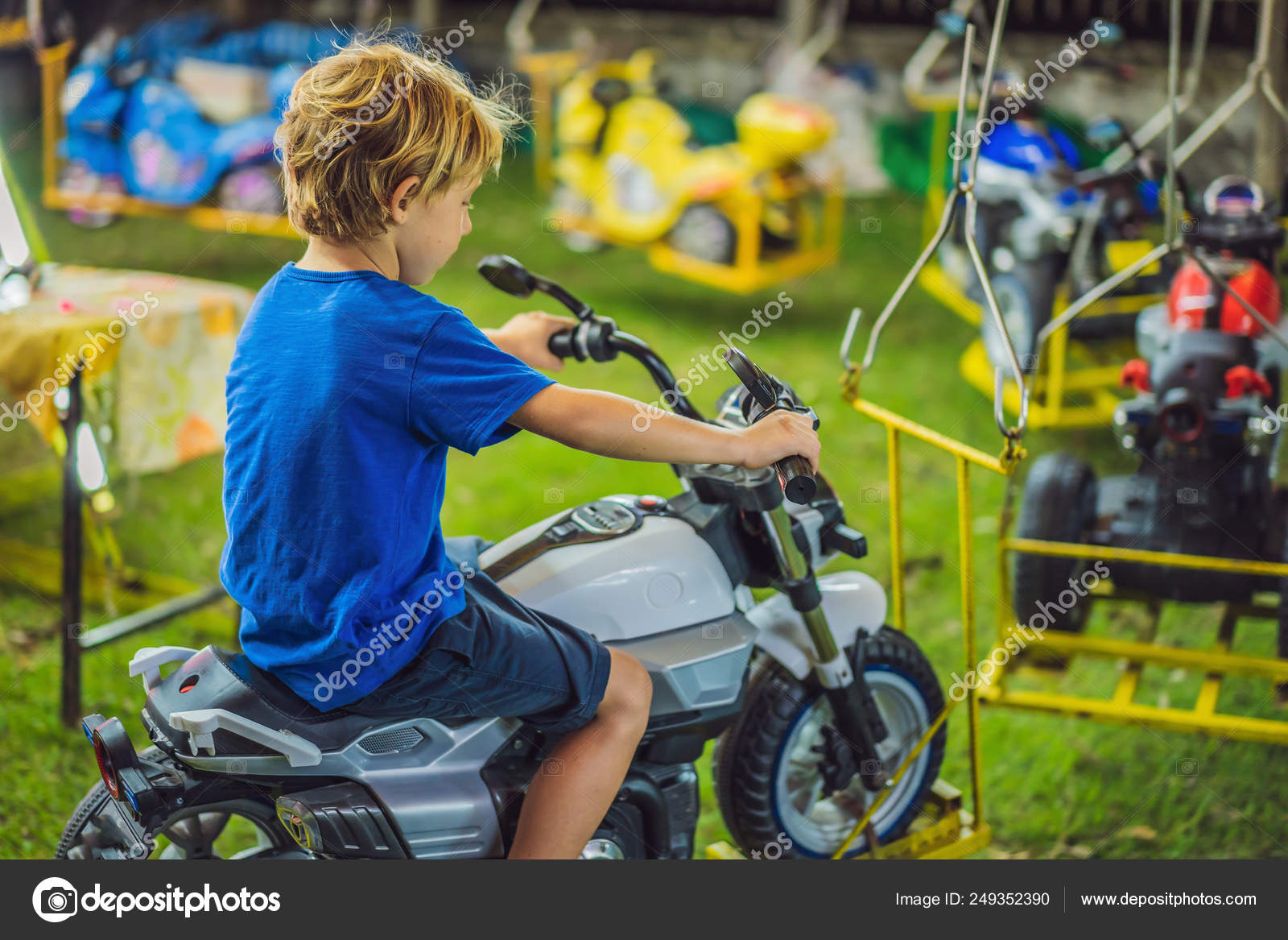 children going on merry go round kids play on carousel in the summer stock photo c galitskaya 249352390 https depositphotos com 249352390 stock photo children going on merry go html