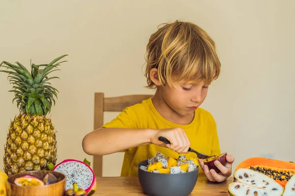 Boy eats fruit. Healthy food for children. Child eating healthy snack. Vegetarian nutrition for kids. Vitamins for children — Stock Photo, Image