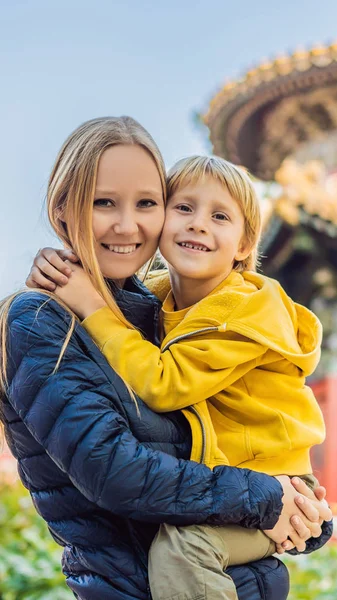 Enjoying vacation in China. Mom and son in Forbidden City. Travel to China with kids concept. Visa free transit 72 hours, 144 hours in China VERTICAL FORMAT for Instagram mobile story or stories size