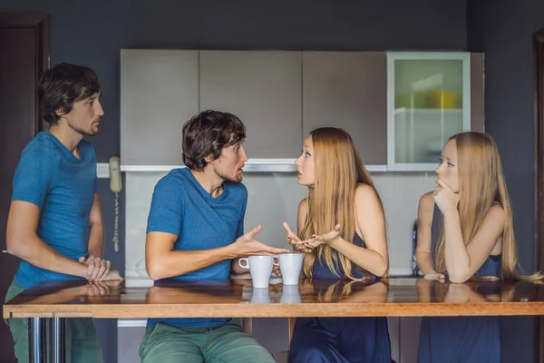 Young couple swears in the kitchen. Watch and evaluate their behavior from the side. Emotional intelligence concept — Stock Photo, Image