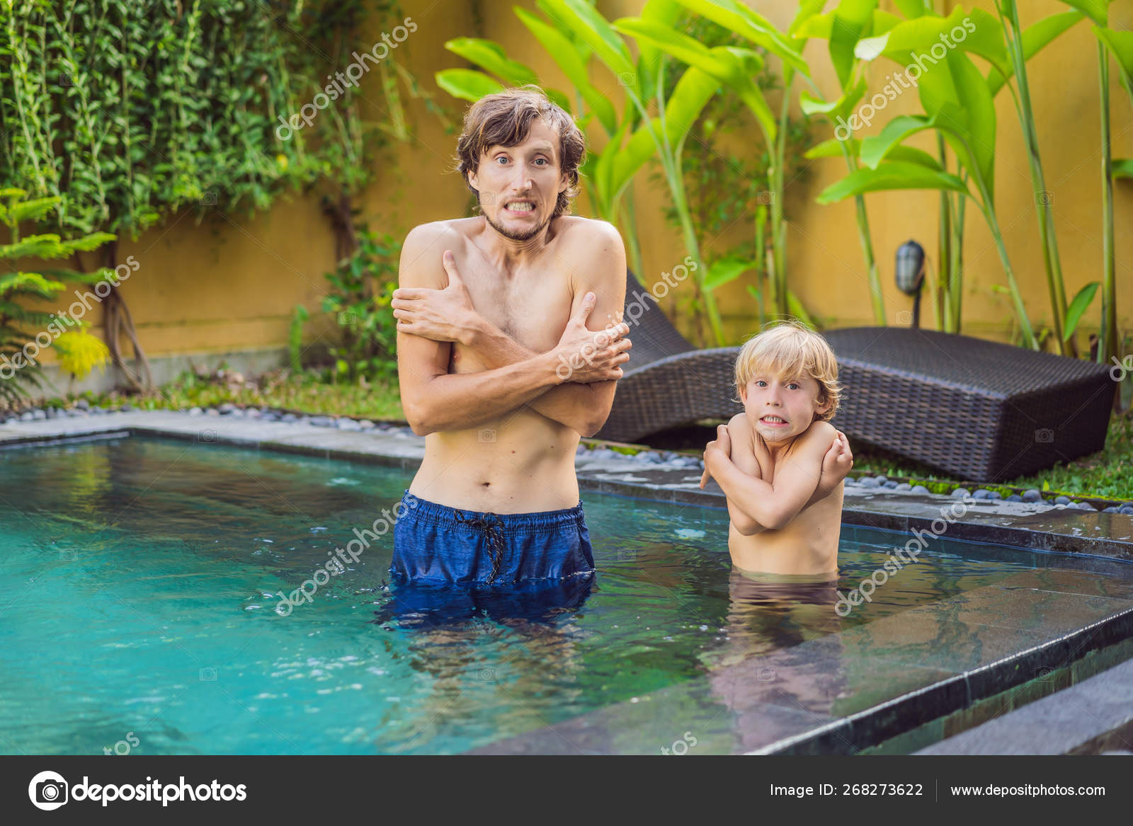 Dad and son was frozen in the Very cold water in the pool