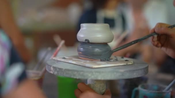 Slowmotion closeup shot of a ceramic bowl that is painted — Stock Video