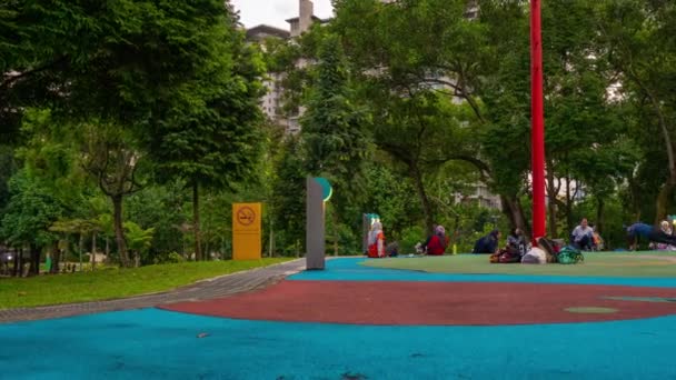 Tymelapse shot of a central park of Kuala Lumpur with lots of people doing sport exercises — Stock Video