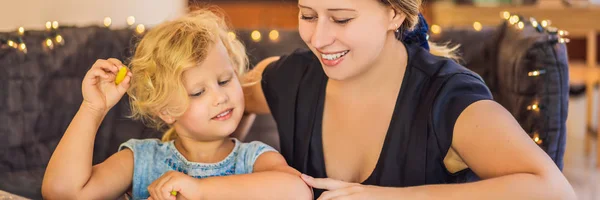 A teacher, a tutor for home schooling and a teacher at the table. Or mom and daughter. Homeschooling BANNER, LONG FORMAT — Stock Photo, Image