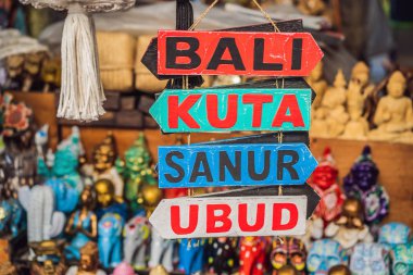 Typical souvenir shop selling souvenirs and handicrafts of Bali at the famous Ubud Market, Indonesia. Balinese market. Souvenirs of wood and crafts of local residents clipart