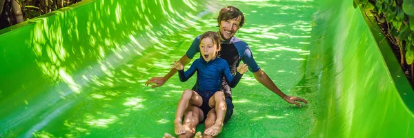 Dad and son have fun at the water park BANNER, LONG FORMAT — Stock Photo, Image