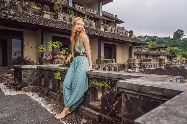 Woman tourist in abandoned and mysterious hotel in Bedugul. Indonesia, Bali Island. Bali Travel Concept — Stock Photo, Image