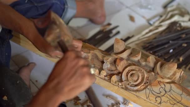 Closeup shot of a master craftsman doing traditional wood carving — Stock Video