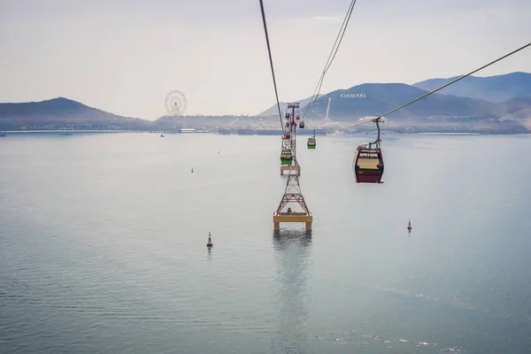 Vietnam, Nha Trang, 24.05.2020: Cable car to Winperl working again after the coronavirus epidemic COVID 19. trip over the sea, an island of entertainment, ferris wheel, crossing the water, a tourist — Stock Photo, Image