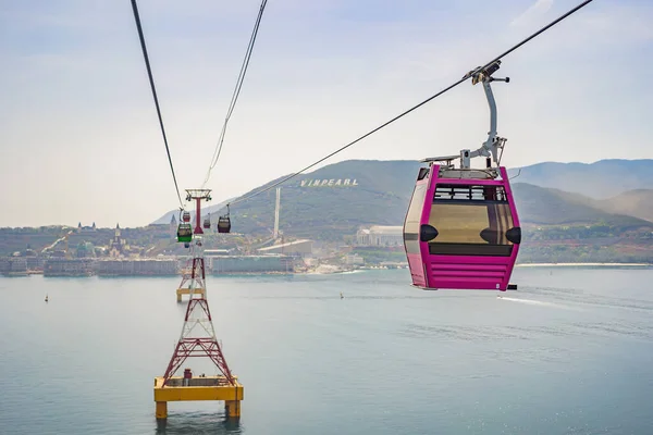 Vietnam, Nha Trang, 24.05.2020: Cable car to Winperl working again after the coronavirus epidemic COVID 19. trip over the sea, an island of entertainment, ferris wheel, crossing the water, a tourist — Stock Photo, Image