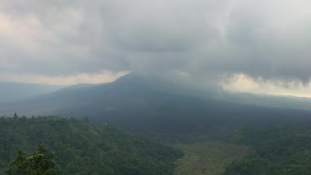 Timelapse shot of clouds moving over the Batur volcano on the Bali island. Travel to Bali concept — Stock Video