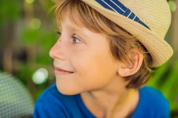 Cute little boy in a fashionable hat in cafe — Stock Photo, Image