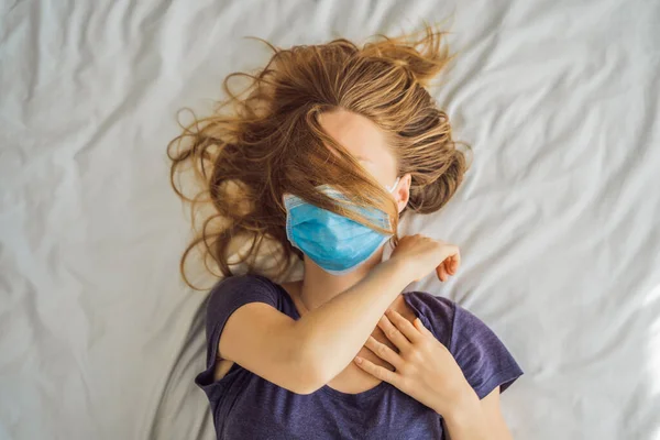 Extremly tired young woman lying on the bed, home alone. self-isolation at home, quarantine due to pandemic COVID 19. Mental health problems in self-isolation at home — Stock Photo, Image