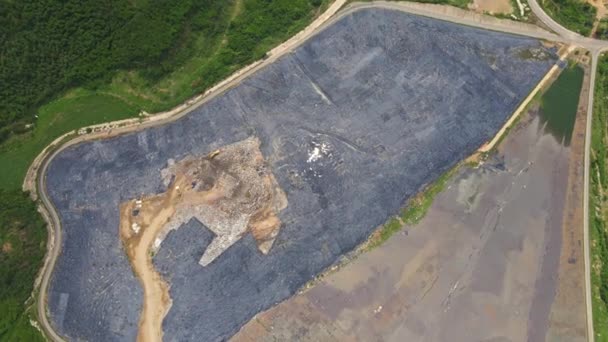 Aerial top view video of a solid waste landfill. City waste treatment location. Environmental pollution. Toxic wastes pollution concept — Stock Video