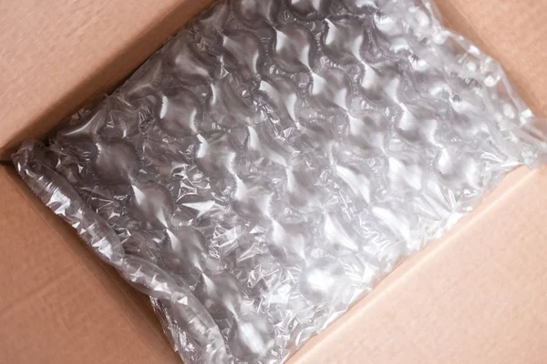 Envoltura Plástico Con Grandes Burbujas Caja Cartón —  Fotos de Stock