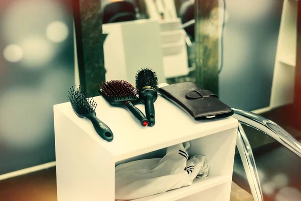 Professional beautician hairdressing tools and accessories at beauty salon. Toned image