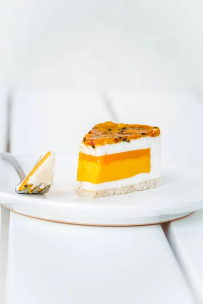 Piece Mango Coconut Passion Fruit Cake White Wooden Table Minimalism — Stock Photo, Image