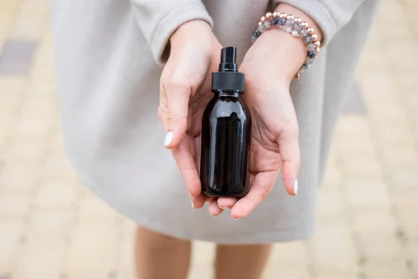 Woman Holding Glass Brown Bottle Spa Cosmetics Beauty Blogging Salon — Stock Photo, Image