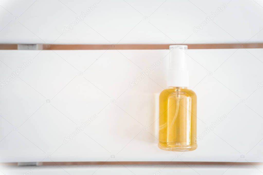Spa face, hair, body oil bottle, cleanser, anti ageing treatment from above on white table. Beauty industry, branding mockup, package design template. 